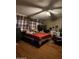 Bedroom with double bed, dresser, and ceiling fan at 12629 S Tuthill Rd, Buckeye, AZ 85326