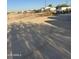 View of vacant lot with tire tracks at 12629 S Tuthill Rd, Buckeye, AZ 85326