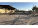 Side view of the home, showing covered patio area at 12629 S Tuthill Rd, Buckeye, AZ 85326