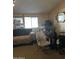 Cozy living room featuring a sofa and comfortable chairs at 12629 S Tuthill Rd, Buckeye, AZ 85326