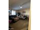 Living room with sofa and window at 12629 S Tuthill Rd, Buckeye, AZ 85326