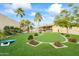 Landscaped backyard with putting green and cornhole at 13454 N 88Th Pl, Scottsdale, AZ 85260