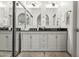 Elegant bathroom with dual sinks, large mirrors, and modern vanity at 13454 N 88Th Pl, Scottsdale, AZ 85260