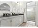 Bathroom with dual sinks, granite countertop and a shower at 13454 N 88Th Pl, Scottsdale, AZ 85260
