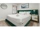 Bedroom with a plush bed, window seat and decorative headboard at 13454 N 88Th Pl, Scottsdale, AZ 85260