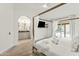 Main bedroom with a canopy bed, en-suite bathroom, and pool access at 13454 N 88Th Pl, Scottsdale, AZ 85260