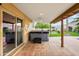 Covered patio with hot tub and access to backyard at 13454 N 88Th Pl, Scottsdale, AZ 85260