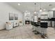 Modern kitchen with island, stainless steel appliances, and fireplace at 13454 N 88Th Pl, Scottsdale, AZ 85260