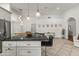Spacious kitchen featuring a large granite island and pendant lighting at 13454 N 88Th Pl, Scottsdale, AZ 85260