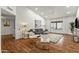 Spacious living area showcasing hardwood floors, a cozy seating arrangement, and large windows at 13454 N 88Th Pl, Scottsdale, AZ 85260