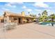 Outdoor dining area with pool and built-in BBQ at 13454 N 88Th Pl, Scottsdale, AZ 85260