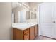 Bathroom with wood vanity and light fixtures at 15041 W Wrigley Way, Surprise, AZ 85374