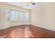 Bedroom with wood flooring and a bay window at 15041 W Wrigley Way, Surprise, AZ 85374