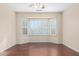 Bedroom with wood flooring and a bay window at 15041 W Wrigley Way, Surprise, AZ 85374