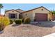 One-story home with a two-car garage and well-maintained landscaping at 15041 W Wrigley Way, Surprise, AZ 85374