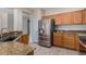 Kitchen boasts granite countertops and stainless steel appliances at 15041 W Wrigley Way, Surprise, AZ 85374