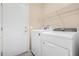 Laundry room with washer, dryer and shelving at 15041 W Wrigley Way, Surprise, AZ 85374