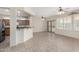 Open concept living area with kitchen and access to backyard at 15041 W Wrigley Way, Surprise, AZ 85374