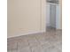 Spacious living room featuring tile floors and an open doorway at 15041 W Wrigley Way, Surprise, AZ 85374
