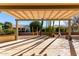 Covered patio with pergola and view of desert plants at 15041 W Wrigley Way, Surprise, AZ 85374