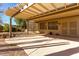 Covered patio with pergola, offering shade and relaxation at 15041 W Wrigley Way, Surprise, AZ 85374