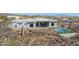 Modern home on a rocky lot featuring a pool, patio, and stunning mountain views at 15214 N Elena Dr, Fountain Hills, AZ 85268