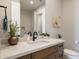 Modern bathroom with wood vanity, quartz countertop, and black matte fixtures at 15214 N Elena Dr, Fountain Hills, AZ 85268