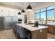 Modern kitchen with large island, stainless steel appliances, and herringbone backsplash at 15214 N Elena Dr, Fountain Hills, AZ 85268