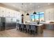 Modern kitchen with white cabinets, large island, and stainless steel appliances at 15214 N Elena Dr, Fountain Hills, AZ 85268