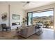 Bright living room with fireplace, large windows, and mountain views at 15214 N Elena Dr, Fountain Hills, AZ 85268