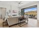 Bright living room featuring a modern fireplace, TV, and sliding doors to the patio at 15214 N Elena Dr, Fountain Hills, AZ 85268