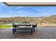 Outdoor patio featuring dining table and seating with desert scenery in the background at 15214 N Elena Dr, Fountain Hills, AZ 85268