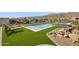Backyard pool and spa on artificial turf with scenic desert landscaping and hillside views at 15214 N Elena Dr, Fountain Hills, AZ 85268