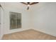 Well-lit bedroom with carpeted floors and a ceiling fan at 15224 N 20Th Pl, Phoenix, AZ 85022