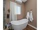 Relaxing bathroom with freestanding soaking tub and hardwood floors at 15848 E Palomino Blvd, Fountain Hills, AZ 85268