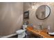 Modern bathroom with glass sink and wooden vanity at 15848 E Palomino Blvd, Fountain Hills, AZ 85268