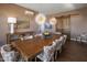 Elegant dining room with large wooden table and statement lighting at 15848 E Palomino Blvd, Fountain Hills, AZ 85268