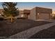 Stunning exterior of a single-story home with a stone facade and landscaped yard at 15848 E Palomino Blvd, Fountain Hills, AZ 85268