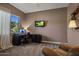 Bright home office features built-in cabinetry and comfortable seating at 15848 E Palomino Blvd, Fountain Hills, AZ 85268