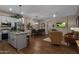 Open concept kitchen and living area with island, stainless steel appliances, and hardwood floors at 15848 E Palomino Blvd, Fountain Hills, AZ 85268