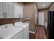 Convenient laundry room with washer, dryer, and extra storage at 15848 E Palomino Blvd, Fountain Hills, AZ 85268
