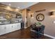 Wet bar with wine cooler and rustic wood accents at 15848 E Palomino Blvd, Fountain Hills, AZ 85268