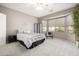 Relaxing bedroom with bay window and neutral decor at 16336 W Salado Creek Dr, Surprise, AZ 85387