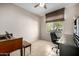 Home office with desk, chair, and built-in shelves at 16336 W Salado Creek Dr, Surprise, AZ 85387
