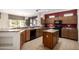 Eat-in kitchen featuring an island and stainless steel appliances at 16336 W Salado Creek Dr, Surprise, AZ 85387