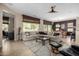 Bright and airy living room with large windows and comfortable seating at 16336 W Salado Creek Dr, Surprise, AZ 85387