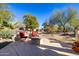 Spacious patio with fire pit and comfortable seating, perfect for outdoor gatherings at 16336 W Salado Creek Dr, Surprise, AZ 85387