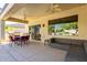 Covered patio with seating area and built-in grill at 16336 W Salado Creek Dr, Surprise, AZ 85387