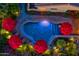 Bird's-eye view of a home with a sparkling pool and red umbrellas at 18059 W Tierra Del Sol Dr, Surprise, AZ 85387