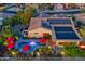 Aerial view of a home with solar panels and a beautiful pool at 18059 W Tierra Del Sol Dr, Surprise, AZ 85387